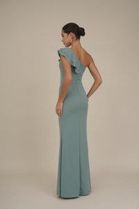 One-shoulder dress in soft teal fabric with ruffled accent. Fitted silhouette, floor-length design, smooth texture, and classic look.