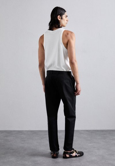 MOSCHINO PANTALONE - Stoffhose - fantasia nero
