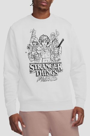 White sweatshirt featuring black line art of Stranger Things characters in action poses with the text "Stranger Things Tales from 85" below.