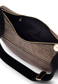 Crossbody bag in textured brown material with a speckled pattern, gold zipper, black lining, and a wide black strap. Interior pocket visible.