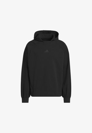 Crna majica s kapuljačom sa zaobljenim rubom, dugim rukavima i rebrastim manžetama. Na prsima je suptilan logo, a na ramenima naglašeni teksturirani detalji.