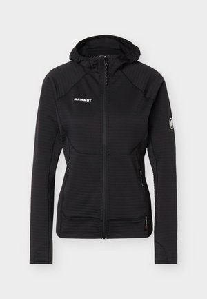 Veste à capuche zippée noire de Mammut avec manches longues, deux poches latérales zippées et logo Mammut sur la poitrine et la manche.