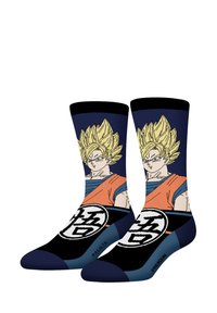 Chaussettes noires et navy présentant un design graphique d'un personnage avec des cheveux blonds en piques, portant une chemise orange et des accents bleus.
