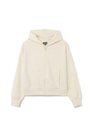 Veste à capuche zippée de couleur crème, fabriquée en tissu doux, dotée d'une poche kangourou, d'une capuche et de poignets côtelés. Pas de motifs ni de détails métalliques.