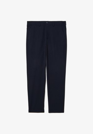 Pantaloni blu navy realizzati in tessuto elasticizzato, con design affusolato, vita elasticizzata, tasche anteriori e chiusura con un singolo bottone.