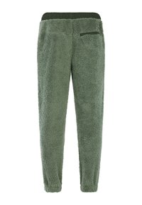 Groene fleece broeken met een zachte, gestructureerde oppervlakte, een elastische tailleband en een ritszak aan de achterkant voor gemak.