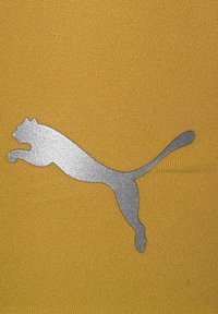 Gelber Stoff mit einer glatten Textur, der an der unteren Partie ein großes, silbernes Puma-Logo in Form eines springenden Katers zeigt.