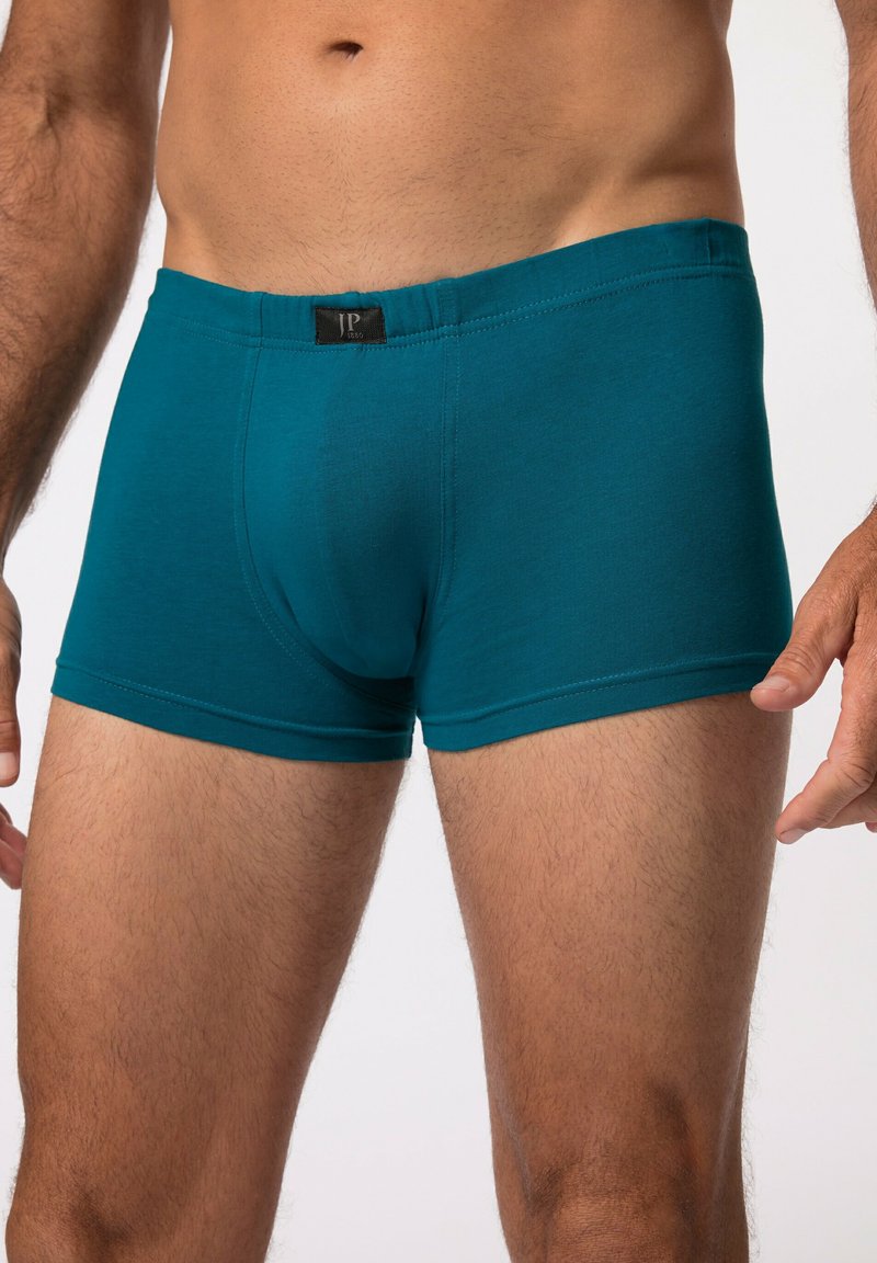 Tyrkysové bavlněné boxerky s černým páskem, s podporující kapsou a hladkou texturou, které poskytují těsný střih.