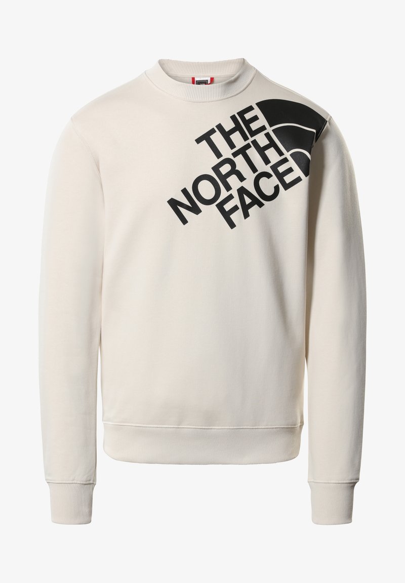 Light beige sweatshirt made of cotton blend, featuring a ribbed crew neck and cuffs. Black text and logo printed diagonally across the front.