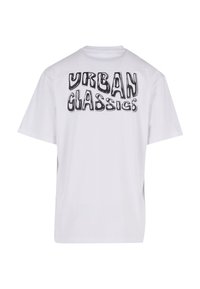 Balta kokvilnas T-krekls ar lielu melnu grafiku uz muguras, kas lasa "URBAN CLASSICS". Kr shortu piedurkņu un apaļo kakla dizains.