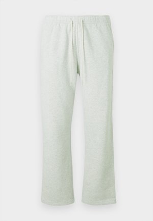 Hellgraue Jogginghose mit elastischem Bund, Kordelzug und geraden Beinen. Weicher Stoff mit subtiler Textur und ohne Muster.