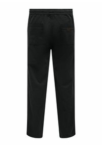 Schwarze Hose mit elastischem Bund, zwei hinteren Taschen und einem dezenten Logosticker. Glattes Material mit lockerer Passform und geraden Beinen.