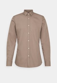 Brown long-sleeve shirt made of smooth fabric, featuring a button-down collar, front buttons, and a standard fit for versatile wear.