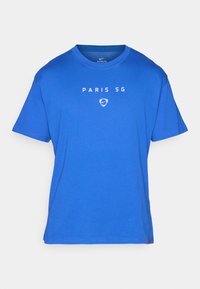 Blå kortærmet T-shirt med rund hals, med "PARIS SG" og et Nike-logo i hvidt på fronten.