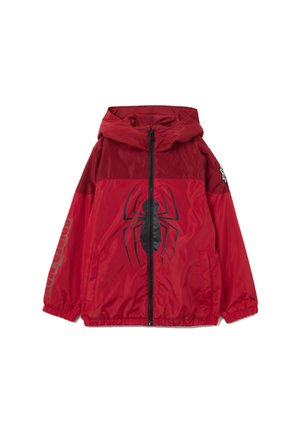Giacca a vento rossa con grafica di un ragno, dotata di zip frontale, polsini elasticizzati e cappuccio. Realizzata in materiale lucido e leggero.