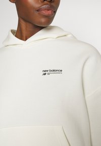 New Balance LINEAR HERITAGE BRUSHED BACK - Sweat à capuche - seasalt