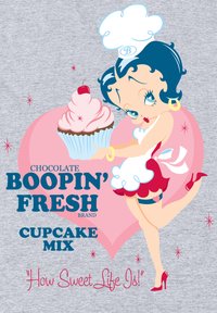 Postać z kreskówki w białej sukience z czerwonymi akcentami trzyma babeczkę. Tekst zawiera "Czekoladowa Mieszanka Babeczek Boopin' Fresh" oraz "Jak Słodkie Jest Życie!".