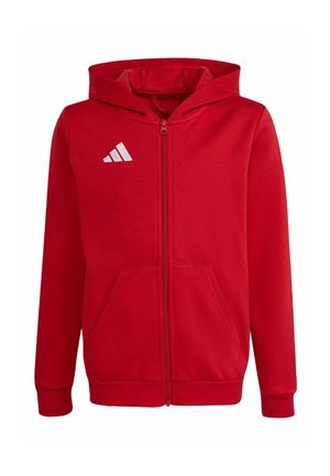 Rotes Hoodie mit durchgehendem Reißverschluss, Kapuze, Fronttaschen, gerippten Bündchen und einem weißen Adidas-Logo auf der linken Brust.