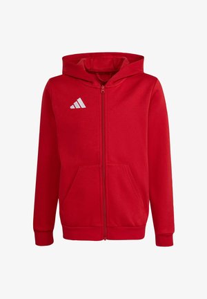 Felpa rossa con cappuccio e zip integrale, tasche frontali, polsini a coste e logo Adidas bianco sul petto sinistro.
