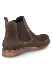 Hnědé kožené chelsea boty s elastickými bočními panely, zaoblenou špicí a texturovaným povrchem. Mají hnědý zúžený podpatek a gumovou podrážku.