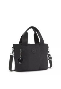 Svart canvas toteväska med dubbla handtag, avtagbar axelrem, logopatch och en fluffig svart apnyckelring som accessoar.