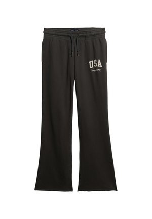 Schwarze Jogginghose aus weichem Material, mit weitem Bein, elastischem Bund und weißem "USA"-Aufdruck an der linken Hüfte.