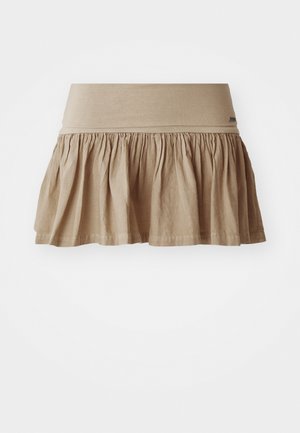 Beige puuvillane seelik gathered hem-iga, millel on lai elastne vöökoht. Kerge materjal pehme tekstuuriga ja lõdva disainiga.