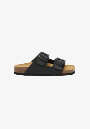 Sandalo nero con fibbie, dotato di soletta in sughero, caratterizzato da due cinturini regolabili, una forma sagomata e una suola in gomma texture.