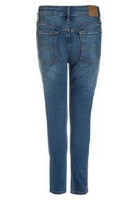 Blå jeans i denim med slim fit, med hög midja, detaljerade bakfickor och en brun läderlapp i midjan.