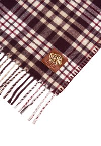 Sciarpa di lana a quadri in rosso scuro, crema e marrone. Presenta estremità frangiate e un'etichetta in pelle marrone con design impressa.