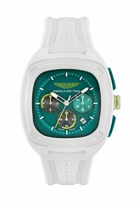 Aston Martin Forma-1 óra négyzet alakú fehér tokjával, türkiz számlapjával és három segédmérőjével. Fehér gumiszíjjal és zöld díszítésekkel rendelkezik.