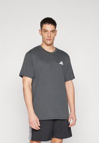 Gray short-sleeve t-shirt in breathable fabric, featuring a small white logo on the left chest. Crew neckline and relaxed fit.