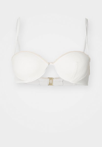 Λευκό σουτιέν με καλυμμένα cups, ρυθμιζόμενους ιμάντες και δαντελένιες λεπτομέρειες. Διαθέτει κεντρικό κούμπωμα με γάντζο και μάτι με χρυσές λεπτομέρειες.