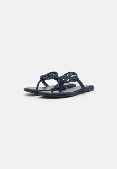 Navy blue sandals with woven strap design, flat sole, and textured finish. Features toe post and circular accents on straps.
