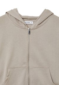 Felpa con zip beige, dotata di tasche frontali e cappuccio integrato, realizzata in tessuto morbido, taglia small, etichetta del marchio visibile all'interno del colletto.