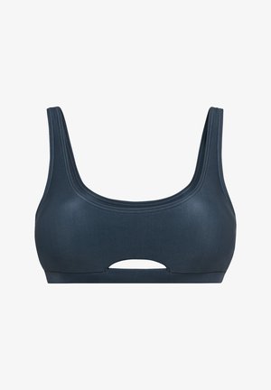 Tumši zila sporta krūšturis ar bieziem siksniņām un taisnām dekoltē līnijām. Tam ir izvietots izgriezums centrā zem krūtīm un gluda tekstūra.