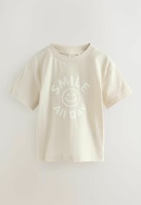Beige katoenen t-shirt met korte mouwen en een ronde hals. Bevat een witte grafische tekst "SMILE All Day" met een lachend gezicht logo.