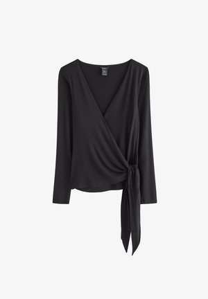 Svart omlottopp i mjukt tyg, med långa ärmar, V-ringning och knytning i midjan.