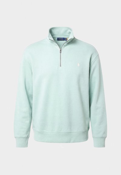 Hellgrüner Sweatshirt mit Viertel-Reißverschluss, langen Ärmeln und kleinem weißem Polo Ralph Lauren Logo auf der linken Brust.