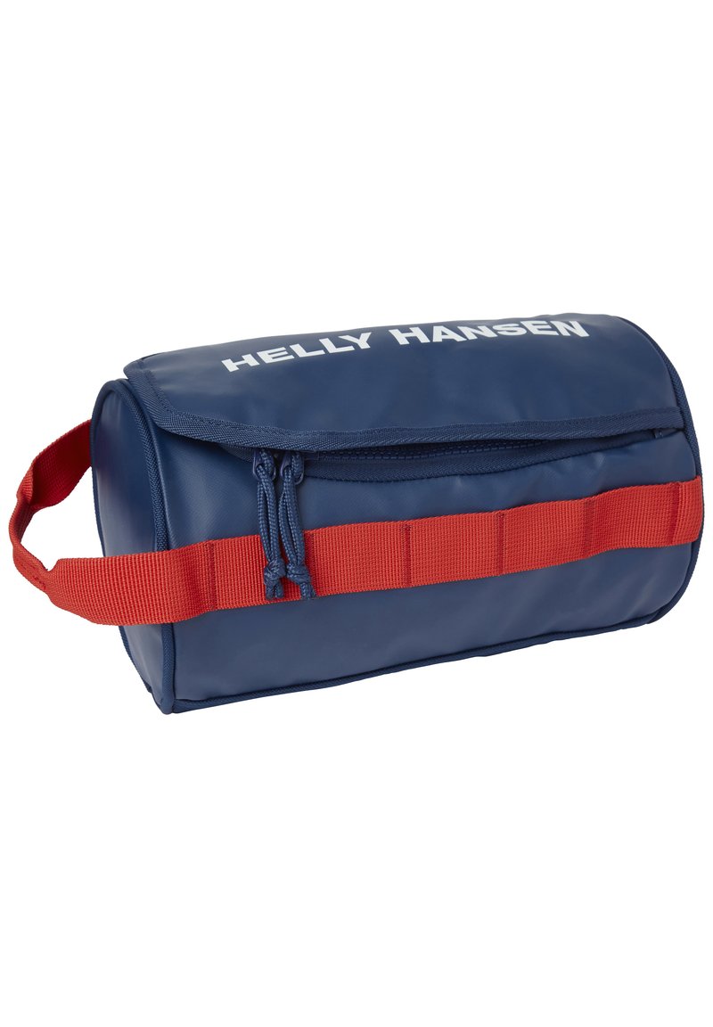 Blå cylindrisk väska tillverkad av vattentätt material, med en röd rem och texten "HELLY HANSEN" i vitt på framsidan.