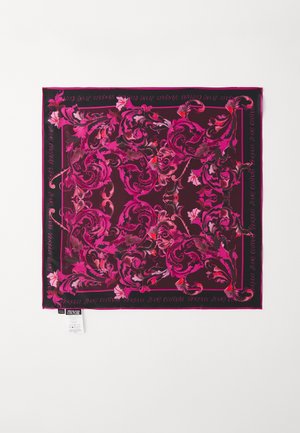 Silk scarf with a dark burgundy background, featuring intricate pink floral patterns and black borders with embossed text. Tag visible at corner.