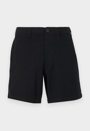 Schwarze Baumwollshorts mit einem Knopfverschluss, seitlichen Taschen und einem geraden Bein-Design. Der Stoff hat eine glatte Textur und ein schlichtes Finish.