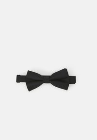 Nœud papillon noir en tissu texturé, présentant une forme classique et une sangle ajustable pour un maintien sécurisé. Design simple sans accents supplémentaires.