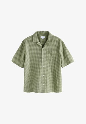 Camicia corta manica, di un verde chiaro, con una sottile fantasia a quadri e una tasca sul petto.