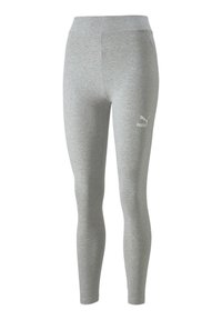 Grå leggings gjorda av mjukt, stretchigt material. Har en hög midja och en liten vit Puma-logga på vänster lår. Slät textur.