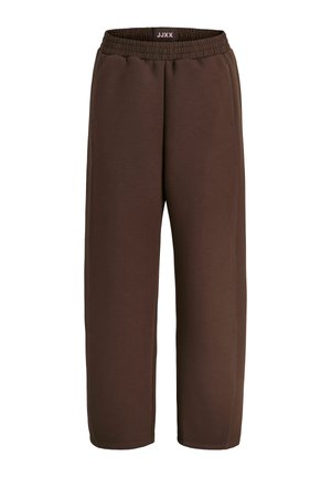 Pantalon de survêtement marron, coupe ample, avec ceinture élastique et poches latérales, conçu pour un usage décontracté.