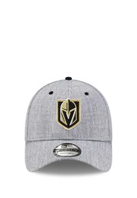 Gray adjustable cap with a rounded crown, featuring a prominent black and gold logo at the front and a smooth textured fabric.