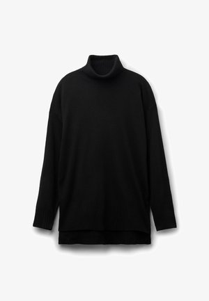 Pulls en col roulé noir en matériau tricoté doux, avec une coupe décontractée, un col côtelé et des manches longues avec des poignets côtelés.