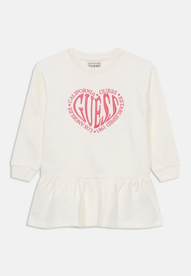 Weißes langärmliges Kleid mit ausgestelltem Saum. Hat ein zentrales pinkfarbenes grafisches Herzdesign auf der Brust. Aus weichem Baumwollmaterial.