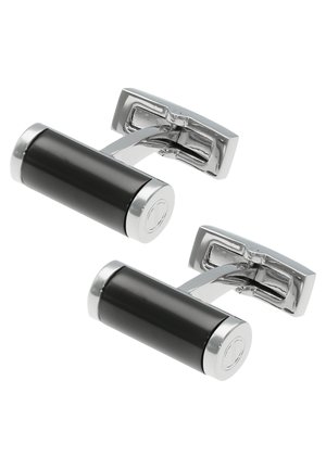 Schwarze zylindrische Manschettenknöpfe mit Chromakzenten, ausgestattet mit einer polierten Oberfläche und einem schwenkbaren Design für einfaches Anlegen.